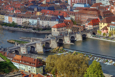 High angle view of river amidst buildings in city