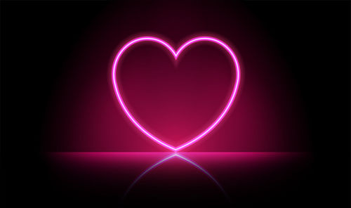 Abstract image of illuminated heart shape against black background