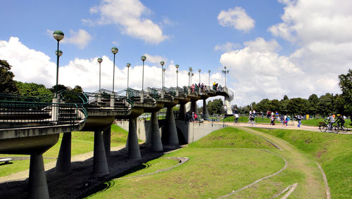 Group of people in park against sky