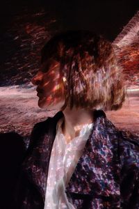 Close-up portrait of woman looking down