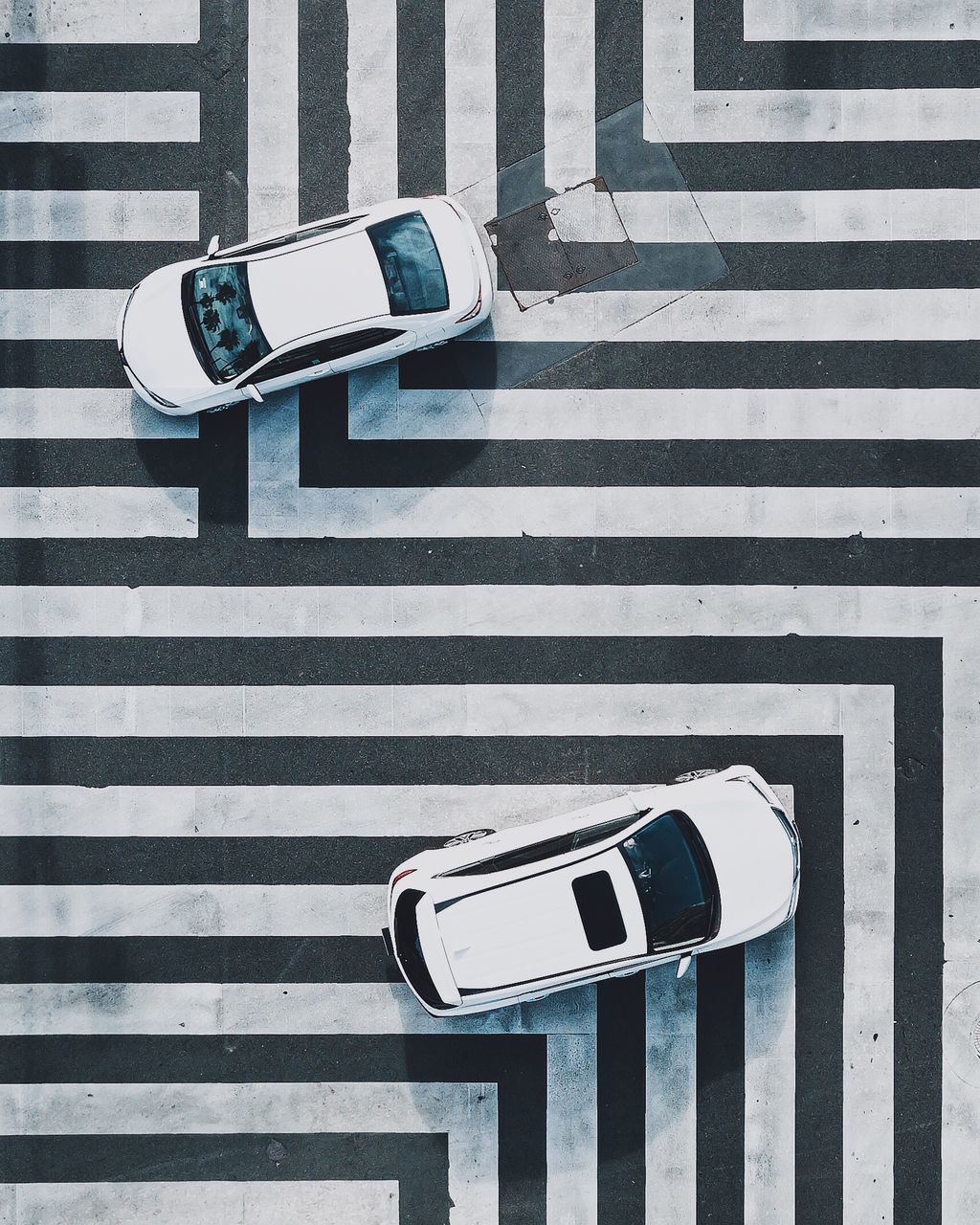 high angle view, sign, symbol, crosswalk, transportation, zebra crossing, crossing, road marking, communication, marking, technology, street, city, road, day, mode of transportation, land vehicle, striped, motor vehicle, car, no people, outdoors