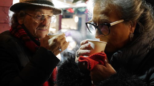 Man and woman drinking coffee in cup