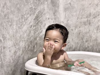 Portrait of boy in bathtub