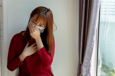 Woman standing at home