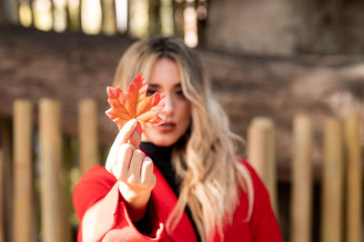 Young woman holding flower