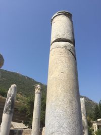 Low angle view of tower against clear blue sky