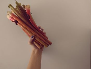 Close-up of hands over white background