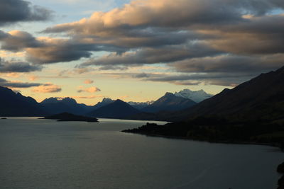 Scenic view of mountains against cloudy sky