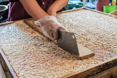 Midsection of person preparing food