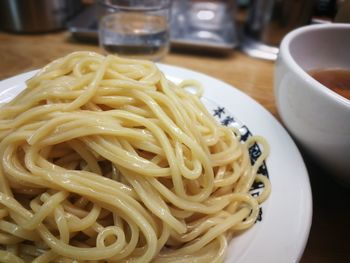 Close-up of noodles in plate on table