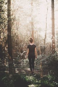 Full length of man standing in forest