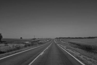 Empty road against clear sky