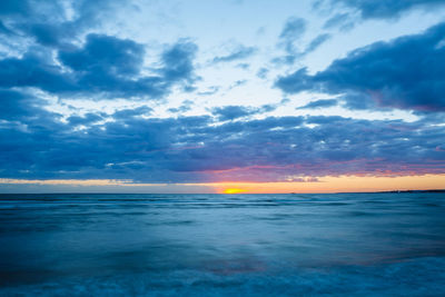 Scenic view of sea against dramatic sky