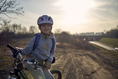 Portrait of boy riding bicycle