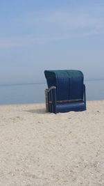 Lifeguard hut on beach against clear sky