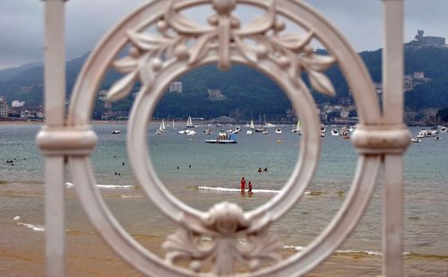 Sea seen through fence