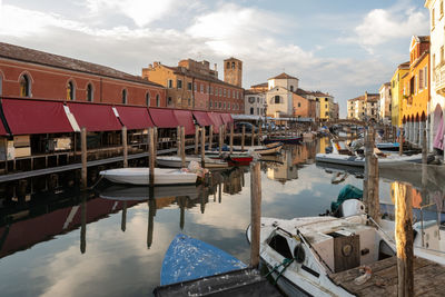 Boats moored at harbor