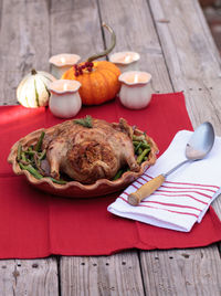 High angle view of roast chicken in container on table