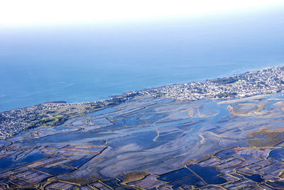 High angle view of sea against blue sky