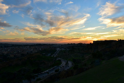 High angle view of buildings against sky during sunset