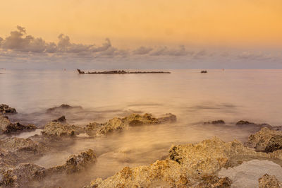 Scenic view of sea against sky during sunset