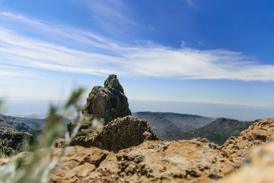 Rock formations on landscape against sky