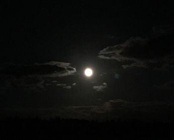 Low angle view of moon against sky at night