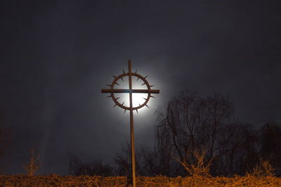 Low angle view of illuminated street light against sky at night