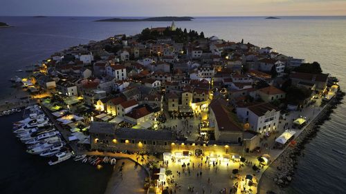 High angle view of illuminated buildings in city