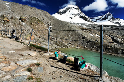 Scenic view of river by mountains against sky at gran paradiso national park