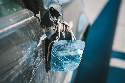 Close-up of metal hanging from car