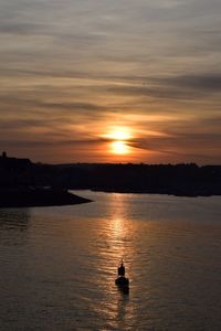 Scenic view of sunset over river