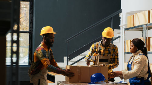 Rear view of man working at construction site