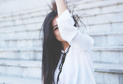 Young woman standing outdoors