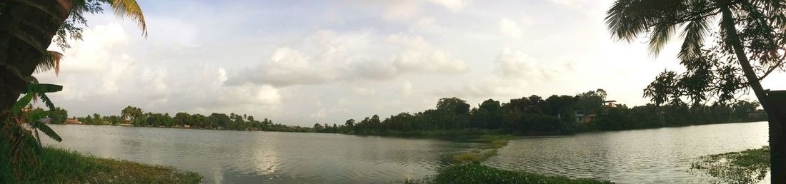 Scenic view of sea against cloudy sky