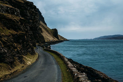 Panoramic view of road by sea against sky