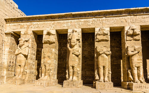 View of sculptures in front of a temple