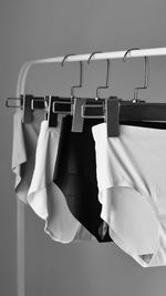 Close-up of clothes hanging on rack