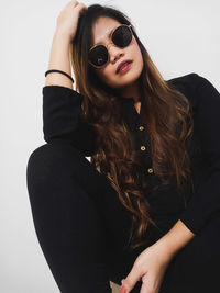 Portrait of young woman wearing sunglasses 