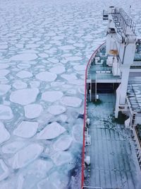 Ice breaker ship surrounded by pancake sea ice in the winter southern ocean close to antarctica