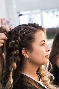 Close-up portrait of a young woman looking away