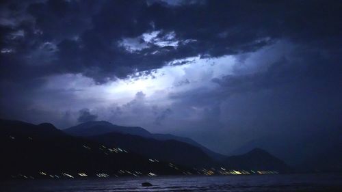 Scenic view of storm clouds over mountains