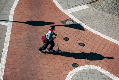 High angle view of person walking on street