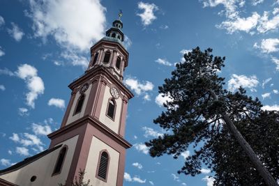 Low angle view of bell tower against sky