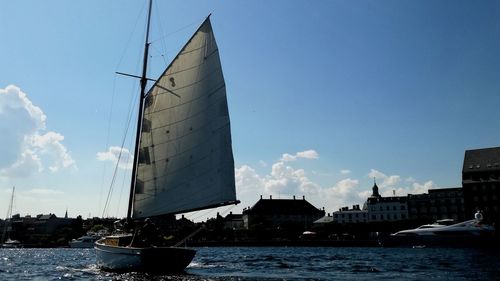 Sailboat on sea against sky