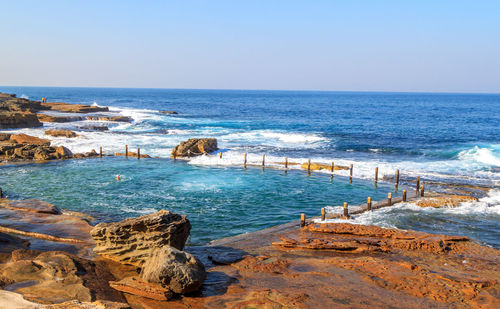 Scenic view of sea against clear blue sky