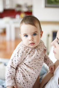 Portrait of cute baby at home