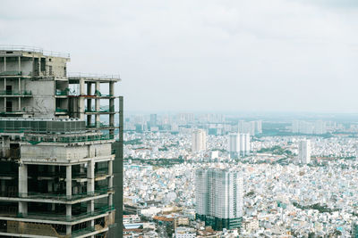 High angle view of buildings in city against sky