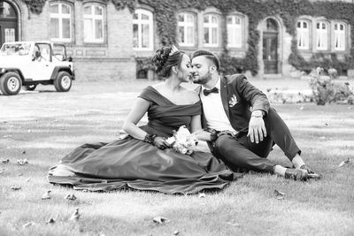 Young couple sitting in city