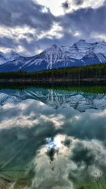 Scenic view of lake against sky at night